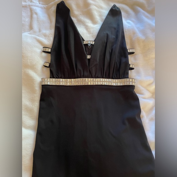 Long black cutout dress. Silver sparkle features on cutouts. - Picture 3 of 3